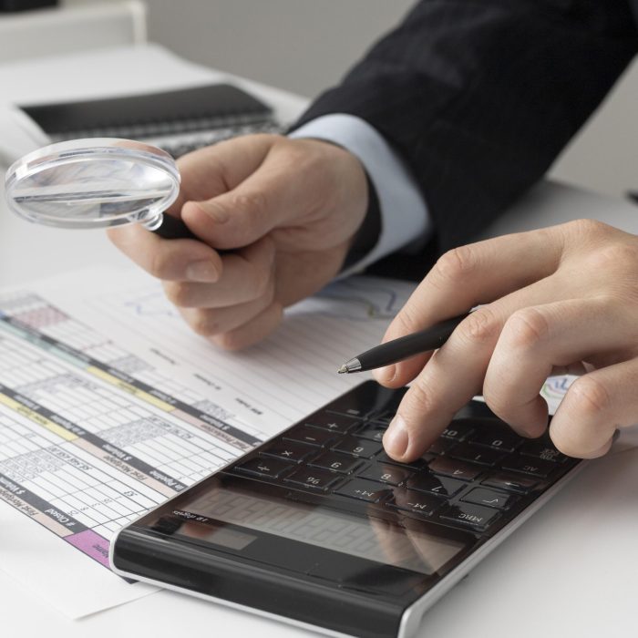 business-man-calculating-finance-numbers